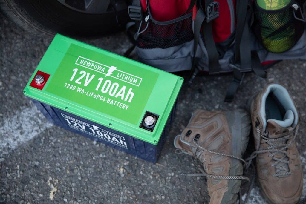 a pair of hiking shoes next to a green box